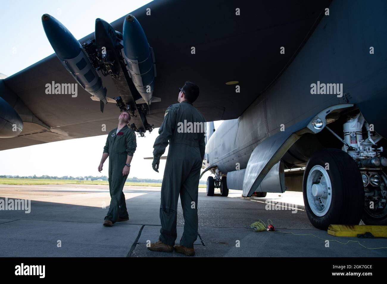 Maj. James Bell, 96th Bomb Squadron aircraft commander, and Capt. Phillip Hightower, 96th BS co-pilot, inspect conventional munitions before takeoff at Barksdale Air Force Base, Louisiana, Aug. 25, 2021. Inspecting munitions is part of an important pre-flight checklist vital to improving flight safety. Stock Photo