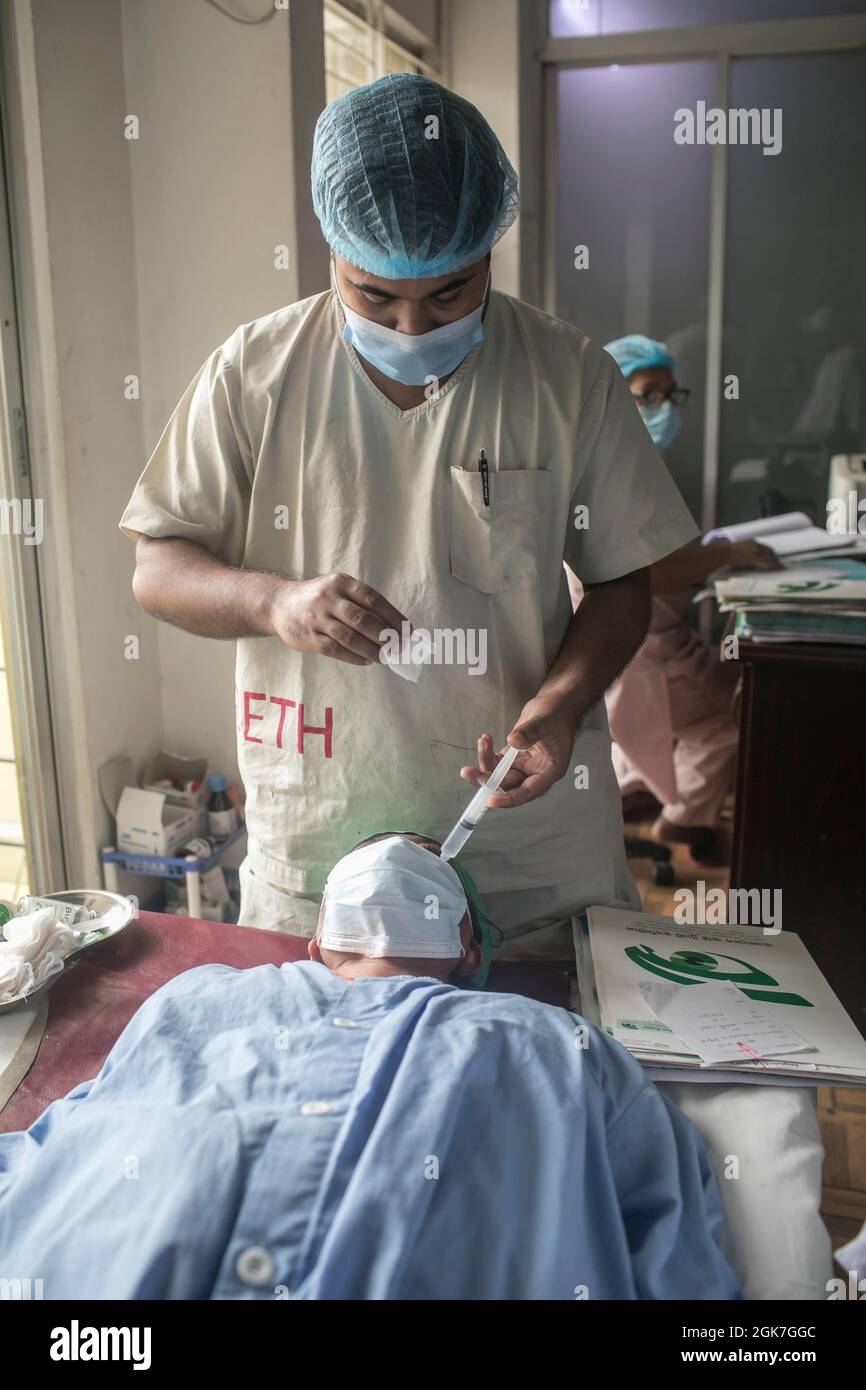 Dhaka, Bangladesh. 13th Sep, 2021. An ophthalmologist examines a
