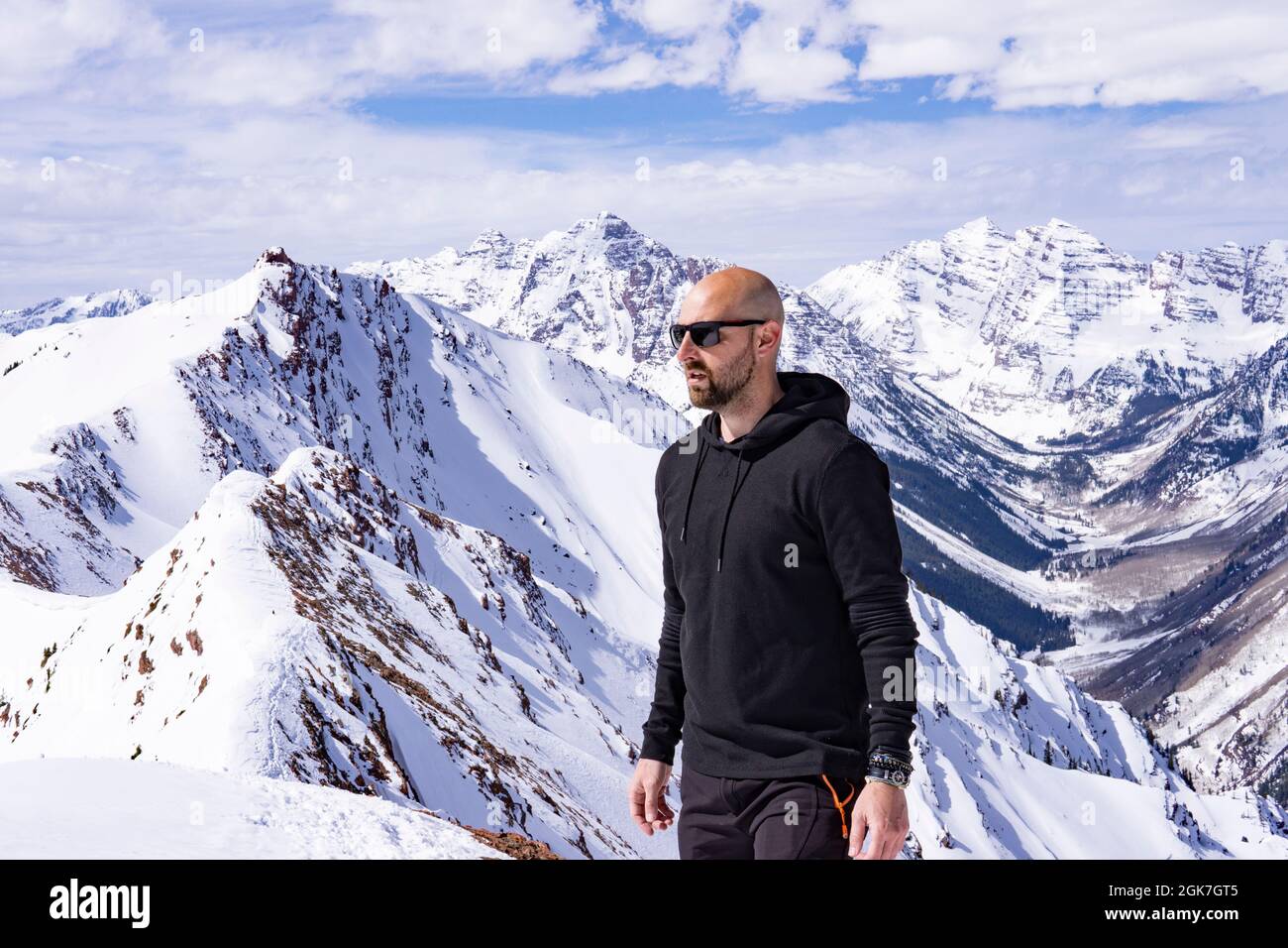 Male Model In Snow Mountain Landscape Extreme Exploration Concept Stock Photo