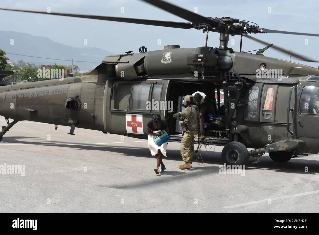 U.S. forces with Joint Task Force – Haiti, airlift injured and displaced Haitian’s to receive medical aid to Port-au-Prince International Airport Aug. 26, 2021.  Since Aug. 26 aircrews have given critical medical triage to over 400 Haitians after a 7.2 earthquake hit the area Aug. 14, 2021. Stock Photo