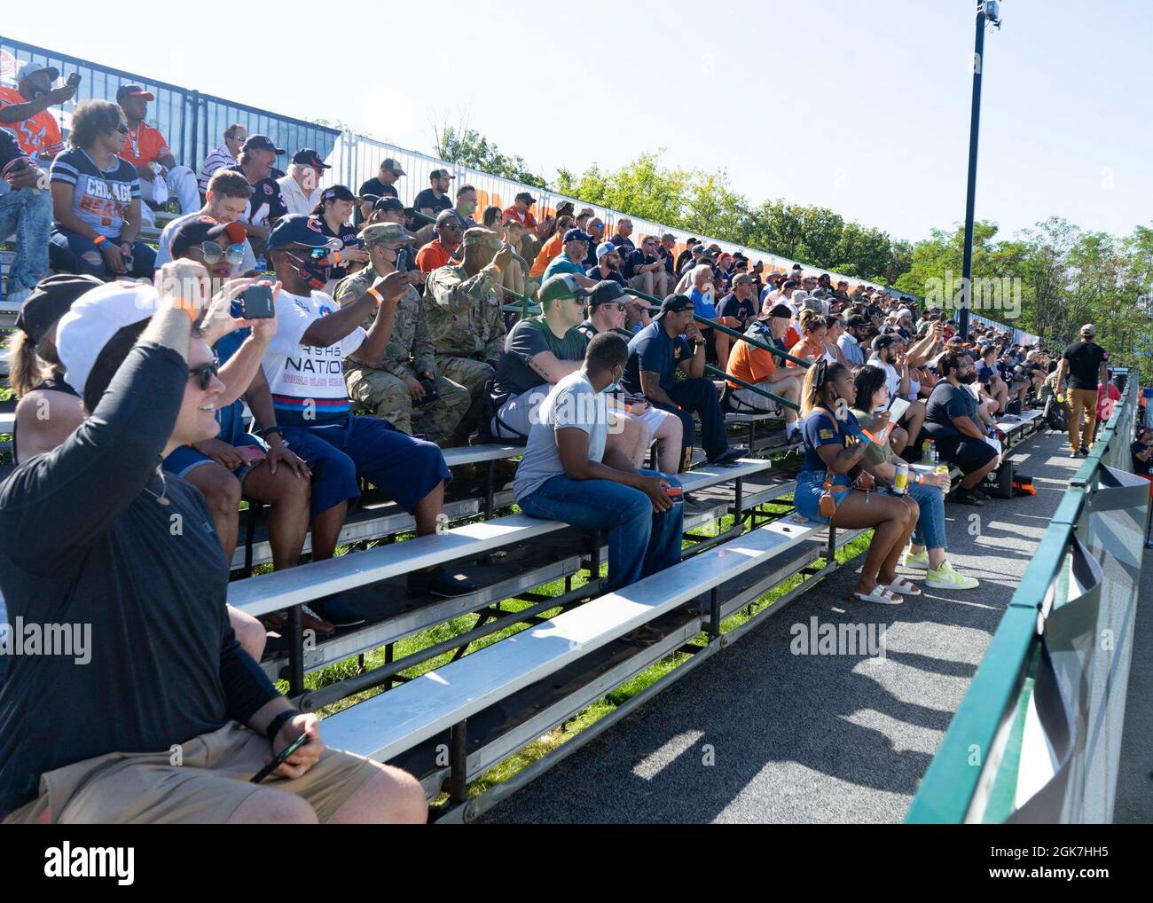 GREAT LAKES, Il. (Aug. 26, 2021) Service members and veterans across various military branches observe the open practice during the Chicago Bears Military Day. Guests were invited to watch a practice and participate in a number of fun activities at Halas Hall, the Bears training facility. Stock Photo