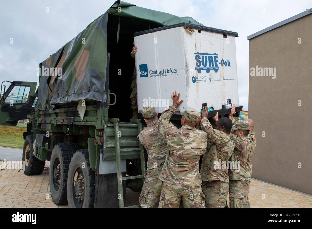 7th Army Training Command Soldiers load donations onto a light medium tactical vehicle for transport to Ramstein Air Base in southwestern Germany Aug. 27, 2021, in Netzaberg, Germany. The donations will support Operation Allies Refuge, an ongoing United States military operation to airlift selected at-risk Afghan civilians, particularly interpreters, U.S. Embassy employees, and other prospective Special Immigrant Visa (SIV) applicants, from Afghanistan. Stock Photo