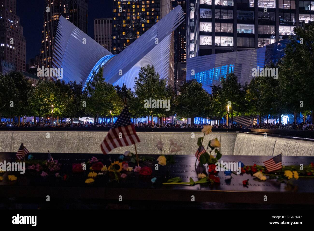 911 Memorial and Museum and the Oculus in blue Tribute Lights on the 20th anniversary of the September 11 attacks. Stock Photo