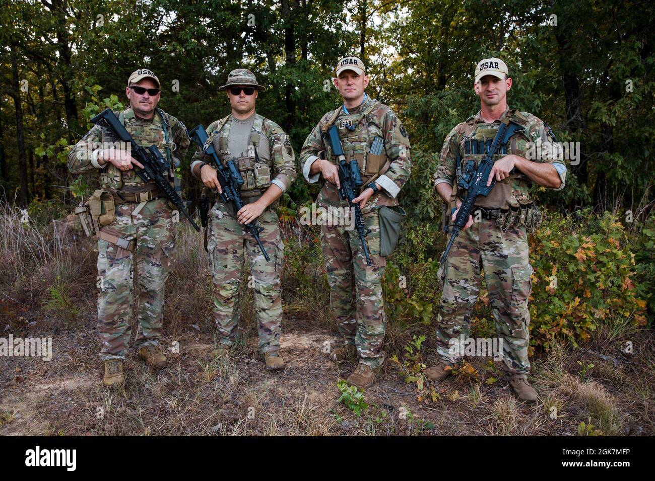 Members of ‘U.S. Army Reserve - Black’ pose for a photo at the 50th Winston P. Wilson & 30th Armed Forces Skill at Arms Meeting, held at the National Guard Marksmanship Training Center on Robinson Maneuver Training Center, North Little Rock, Arkansas. The U.S. Army Reserve marksmanship teams represent the entire U.S. Army Reserve and are chosen for the team through a rigorous selection shoot days before the pistol & rifle championships.    U.S. Army Reserve - Black Members: U.S. Army Maj. Thomas Conners, U.S. Army Sgt. 1st Class Jason Godel, U.S. Army Staff Sgt. Sean Morris, U.S. Army Sgt. Dev Stock Photo