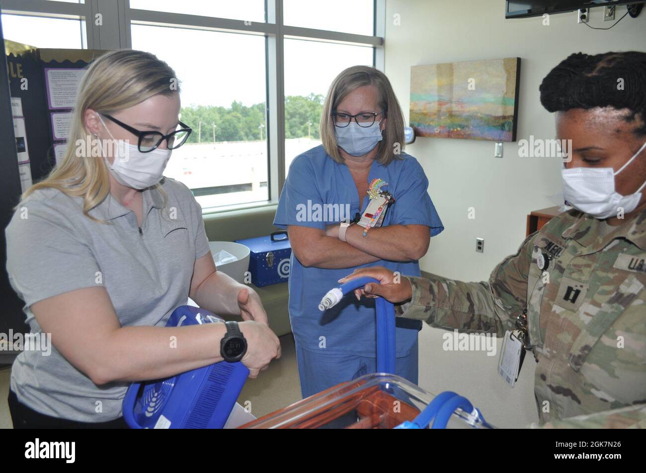 Martin Army Community Hospital Mother-Baby Unit CNOIC Capt. Katherine Basquill-White assembles the CuddleCot. Stock Photo