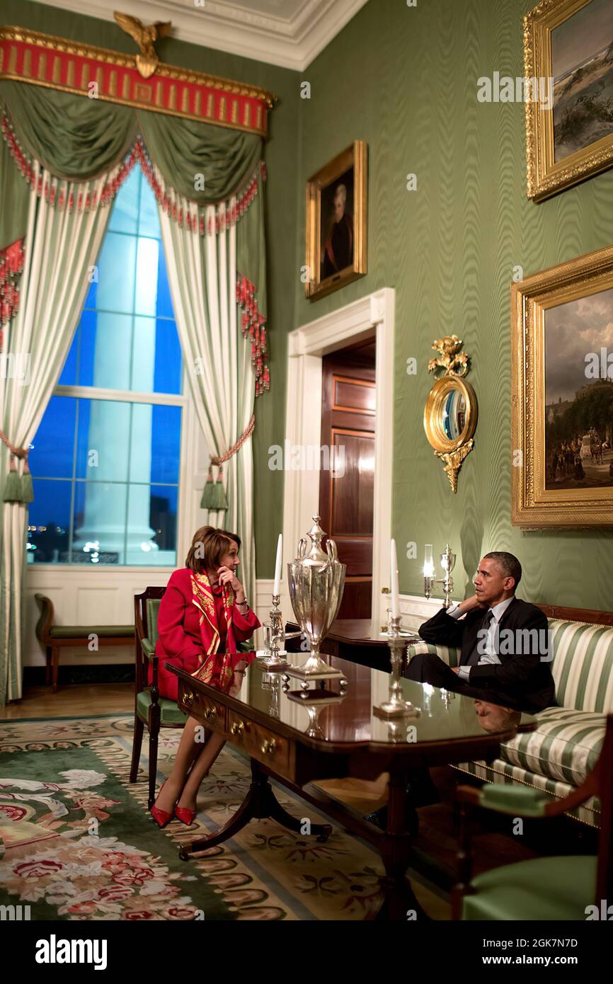 President Barack Obama talks with House Democratic Leader Nancy Pelosi, D-Calif., in the Green Room of the White House, Feb. 4, 2015. (Official White House Photo by Pete Souza) This official White House photograph is being made available only for publication by news organizations and/or for personal use printing by the subject(s) of the photograph. The photograph may not be manipulated in any way and may not be used in commercial or political materials, advertisements, emails, products, promotions that in any way suggests approval or endorsement of the President, the First Family, or the White Stock Photo