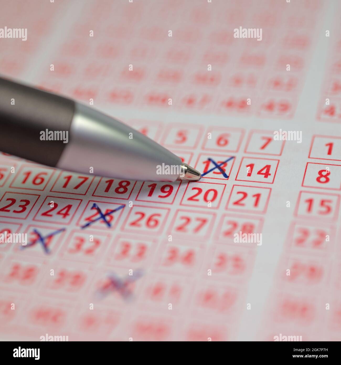 Lottery ticket with ticked winning numbers Stock Photo