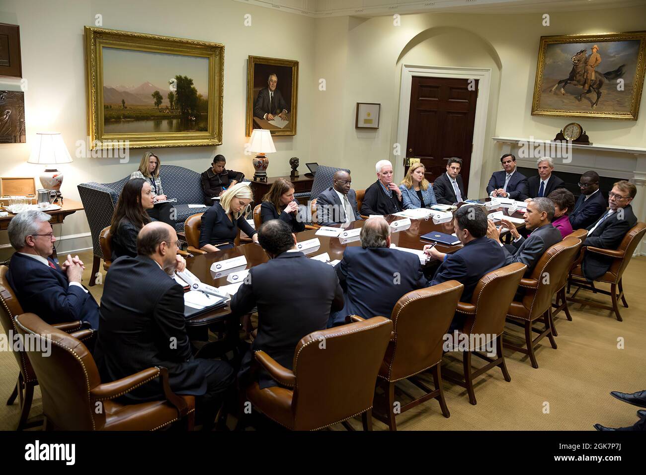 President Barack Obama meets with private sector and foundation leaders who have joined the international response to end the Ebola epidemic, in the Roosevelt Room of the White House, Feb. 11, 2015. (Official White House Photo by Pete Souza) This official White House photograph is being made available only for publication by news organizations and/or for personal use printing by the subject(s) of the photograph. The photograph may not be manipulated in any way and may not be used in commercial or political materials, advertisements, emails, products, promotions that in any way suggests approva Stock Photo