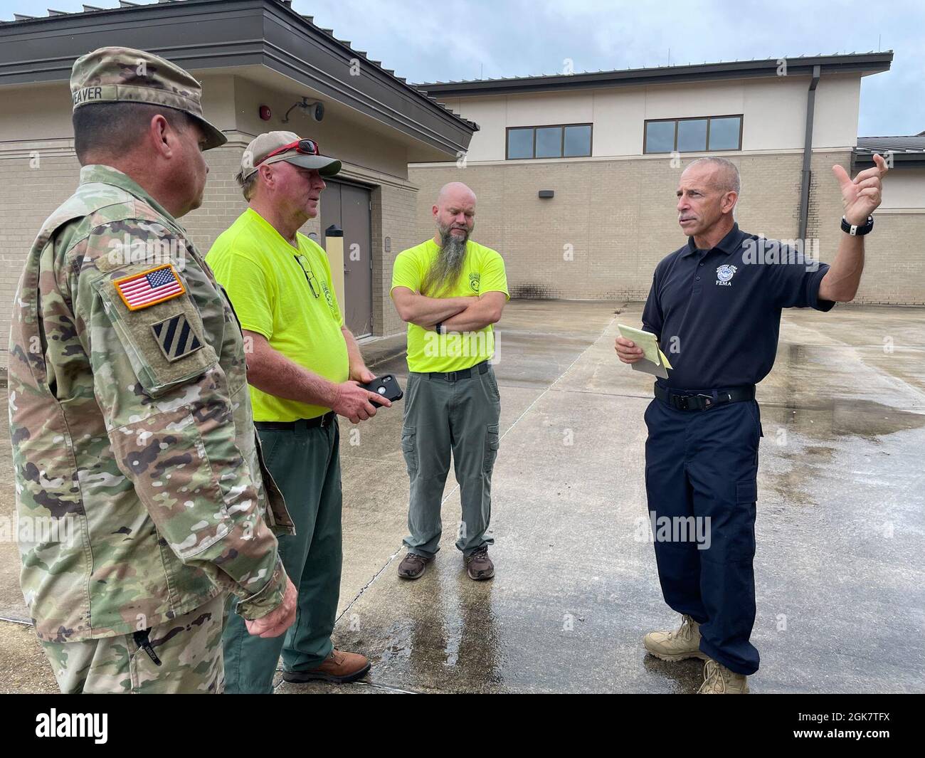 Col. Rick Weaver, Camp Shelby post commander, meets with members from the Federal Emergency Management Agency and the Mississippi Forestry Commission during the early stages of Hurricane Ida. Camp Shelby serves as a staging area for state and federal assets that will assist the citizens of Mississippi in response to the impacts from Hurricane Ida. (Mississippi Army National Guard photos by 2nd Lt. Michael Needham) Stock Photo