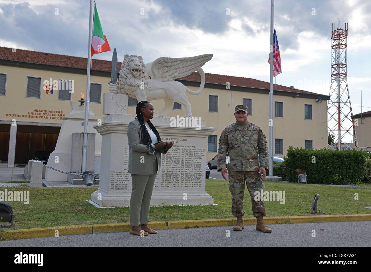 Staff. Sgt. Rogelio Ernesto Hercules, assigned to the 509th Signal Battalion, is joined by his wife as he gives remarks during his re-enlistment ceremony at Caserma Ederle in Vicenza, Italy, Aug. 30, 2021. Stock Photo