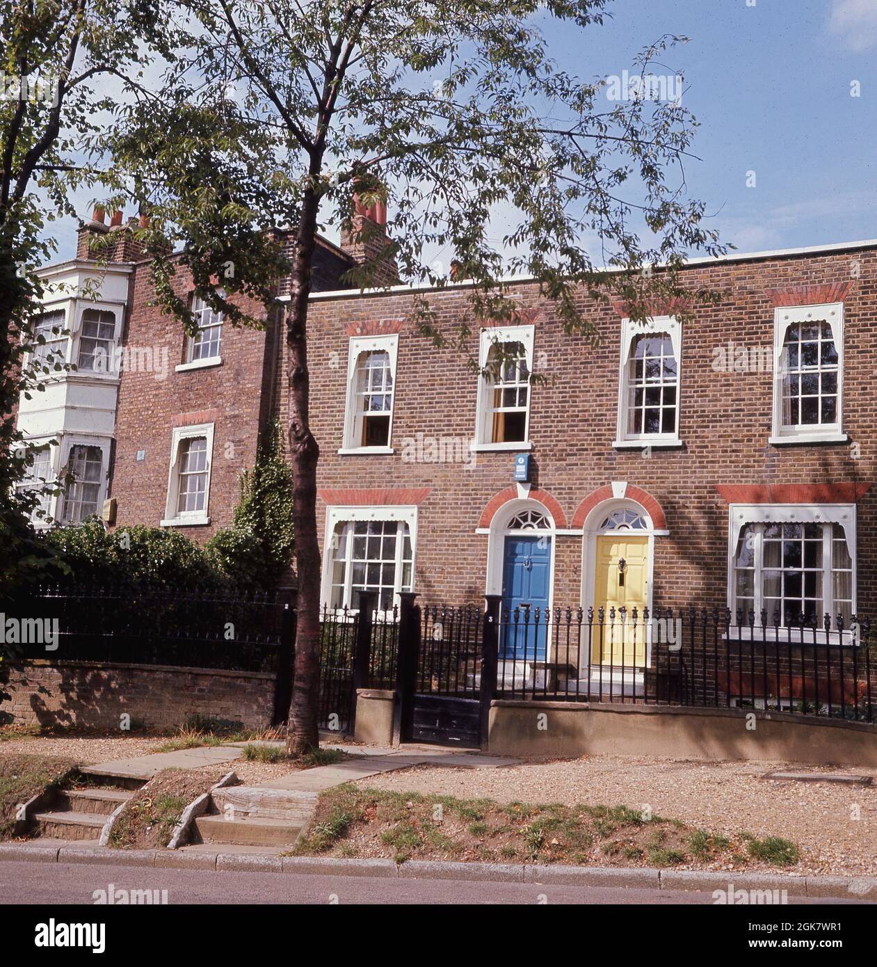 1960s, historical, exterior view of a pair of pretty Georgian terraced houses on the High Street, at Hampstead village, North London, England, UK. Stock Photo