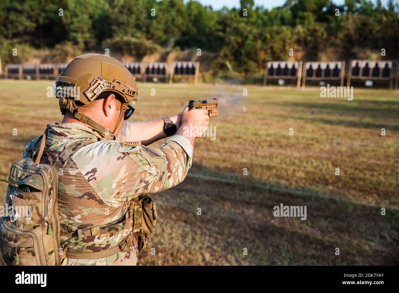 U.S. Staff Sgt. John Jordan, South Carolina National Guard, fires his Pistol during Combat Pistol Excellence-in-Competiton match on Sept. 1 during the 50th Winston P. Wilson Rifle and Pistol Championships at the National Guard Marksmanship Training Center. The objective of this training event is to promote the growth and development of state level marksmanship training, as well as evaluate individual and collective tasks pertaining to that training. Stock Photo