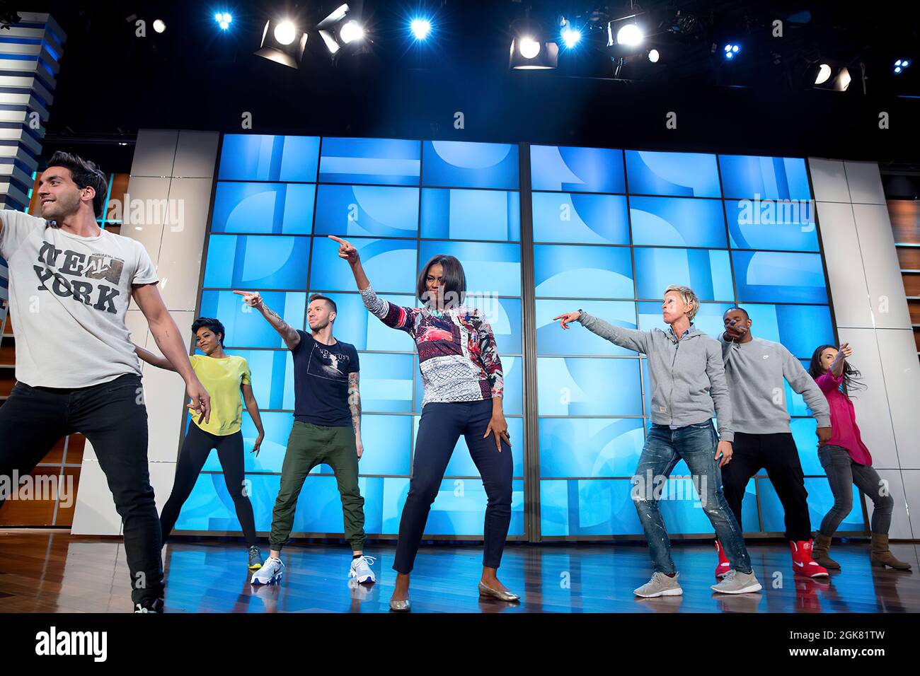 First Lady Michelle Obama rehearses with Ellen DeGeneres and the 'So You Think You Can Dance' dancers for a #GimmeFive 'Let's Move!' dance, prior to a taping of The Ellen DeGeneres Show in Burbank, Calif., March 12, 2015. (Official White House Photo by Amanda Lucidon) This official White House photograph is being made available only for publication by news organizations and/or for personal use printing by the subject(s) of the photograph. The photograph may not be manipulated in any way and may not be used in commercial or political materials, advertisements, emails, products, promotions that Stock Photo