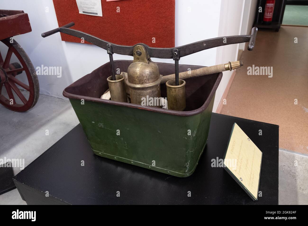 Saku, Estonia - 08.20.2020:  Display in the fire museum. Tubsquirt - fire extinguishing equipment worked by two men. Firefighting history Stock Photo