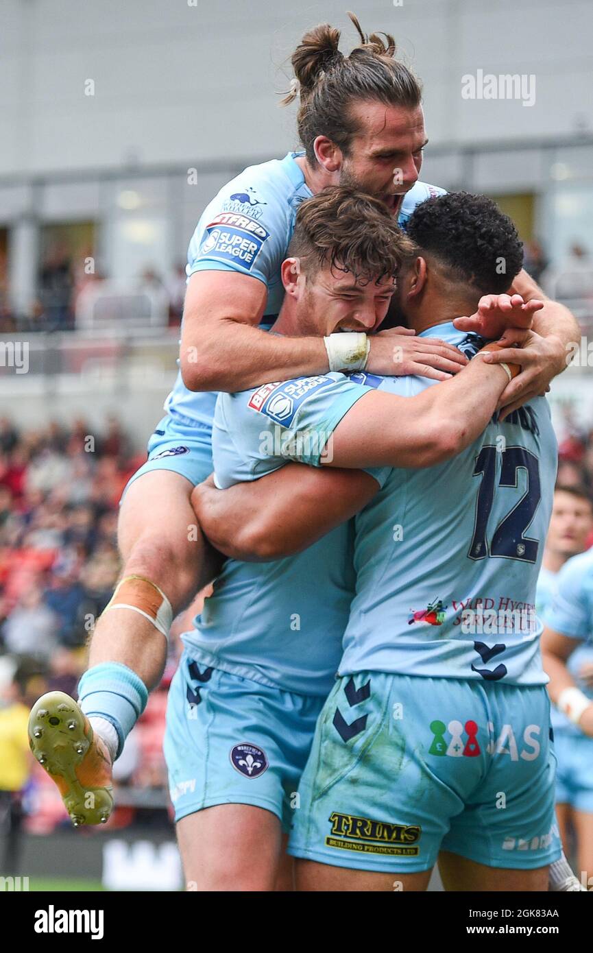Leigh, England - 11 September 2021 -  Wakefield Trinity's Jordan Crowther and Liam Kay celebrate with try scorer Kelepi Tanginoa during the Rugby League Betfred Super League  Leigh Centurions vs Wakefield Trinity at Leigh Sports Village , Leigh, UK Stock Photo