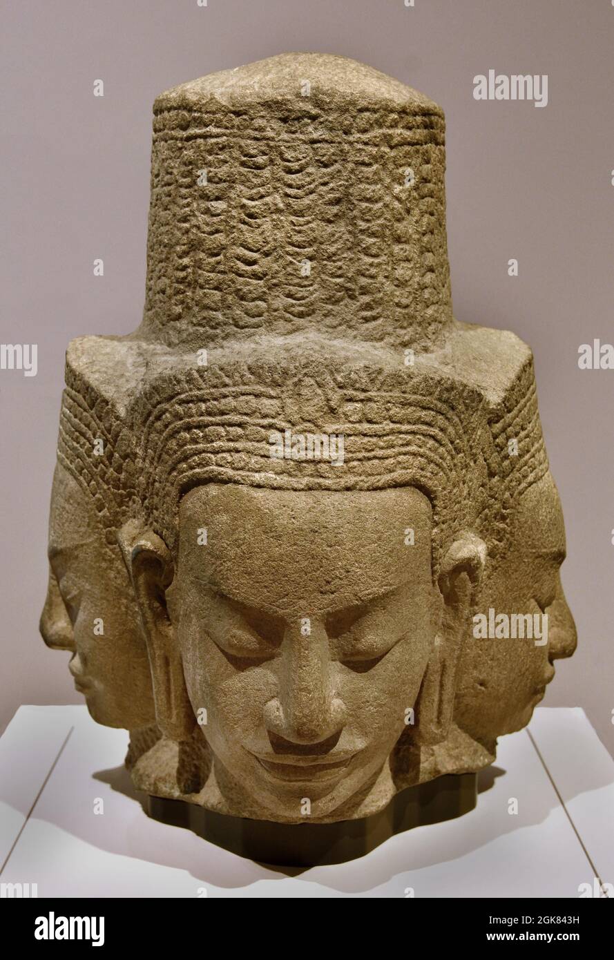 Head of a deity with four faces Cambodia, Angkor 1175-1250 Sandstone,  35.0cm  Cambodian . ( Head, four faces, Buddhist temple of Ta Prohm at Angkor. Perhaps represents Prajnaparamita, the Buddhist goddess of wisdom, rather than a male deity or bodhisattva. ) Stock Photo