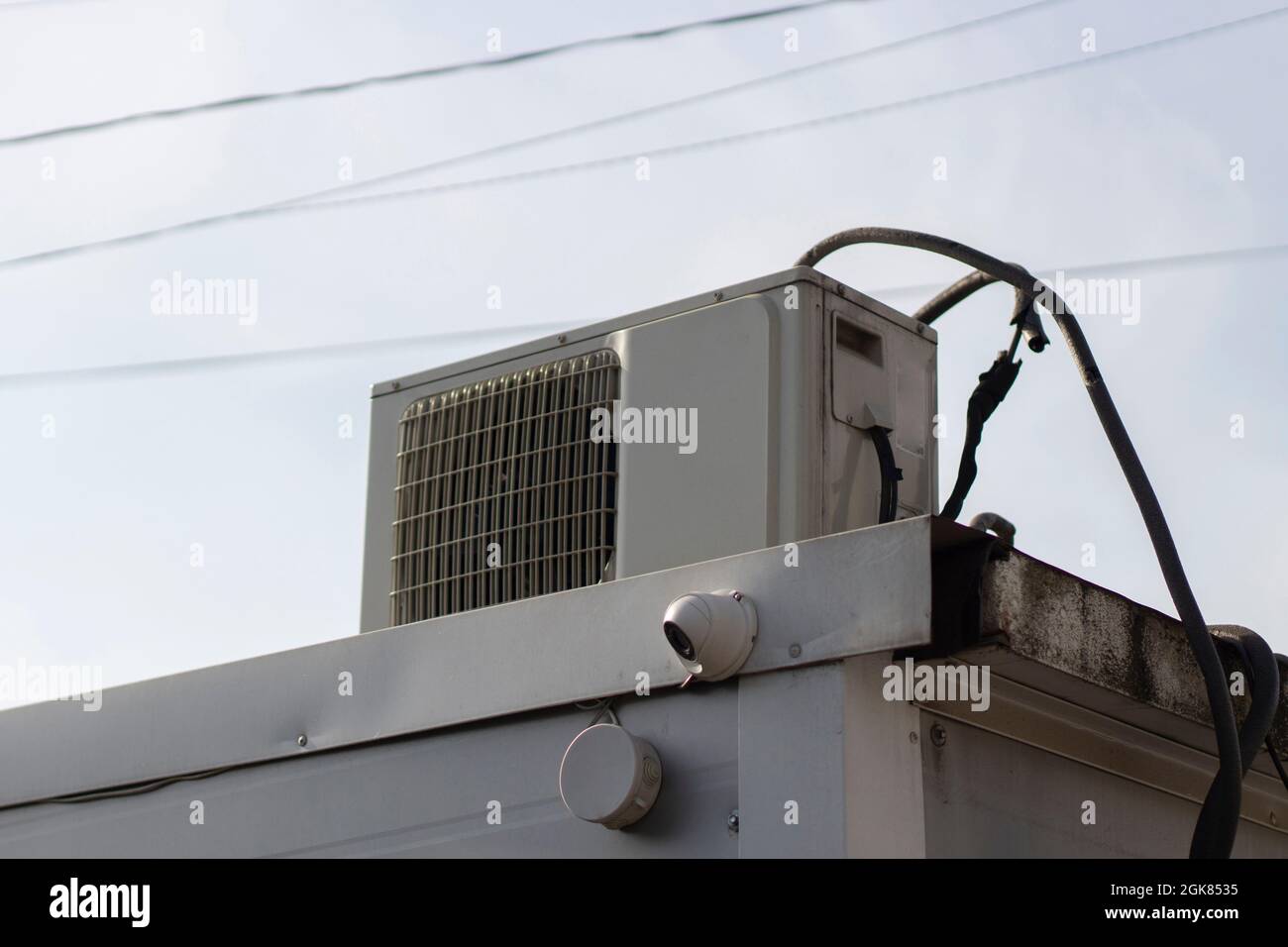 Air conditioning on the roof. The cooling system outside the store. Air conditioning on a hot day. Stock Photo