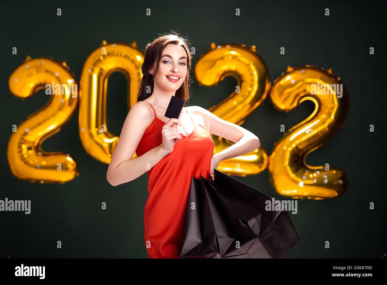 When Is Christmas Black Friday 2022 Woman With Credit Card And Purchases. New Year Shopping. Black Friday. 2022  Balloons Sales Stock Photo - Alamy