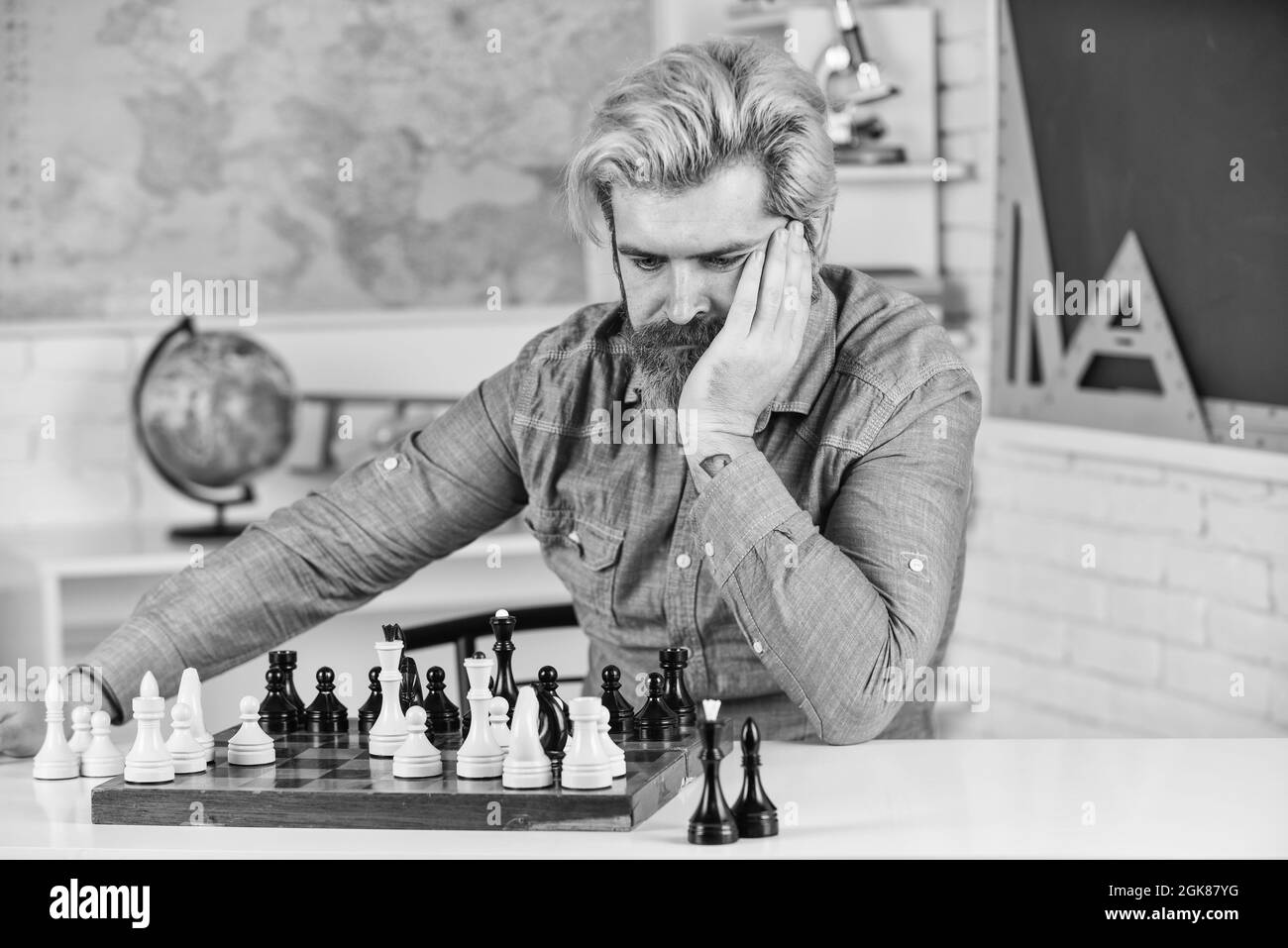Development logics. Chess is life in miniature. Chess lesson. Strategy concept. School teacher. Board game. Playing chess. Intellectual hobby. Figures Stock Photo