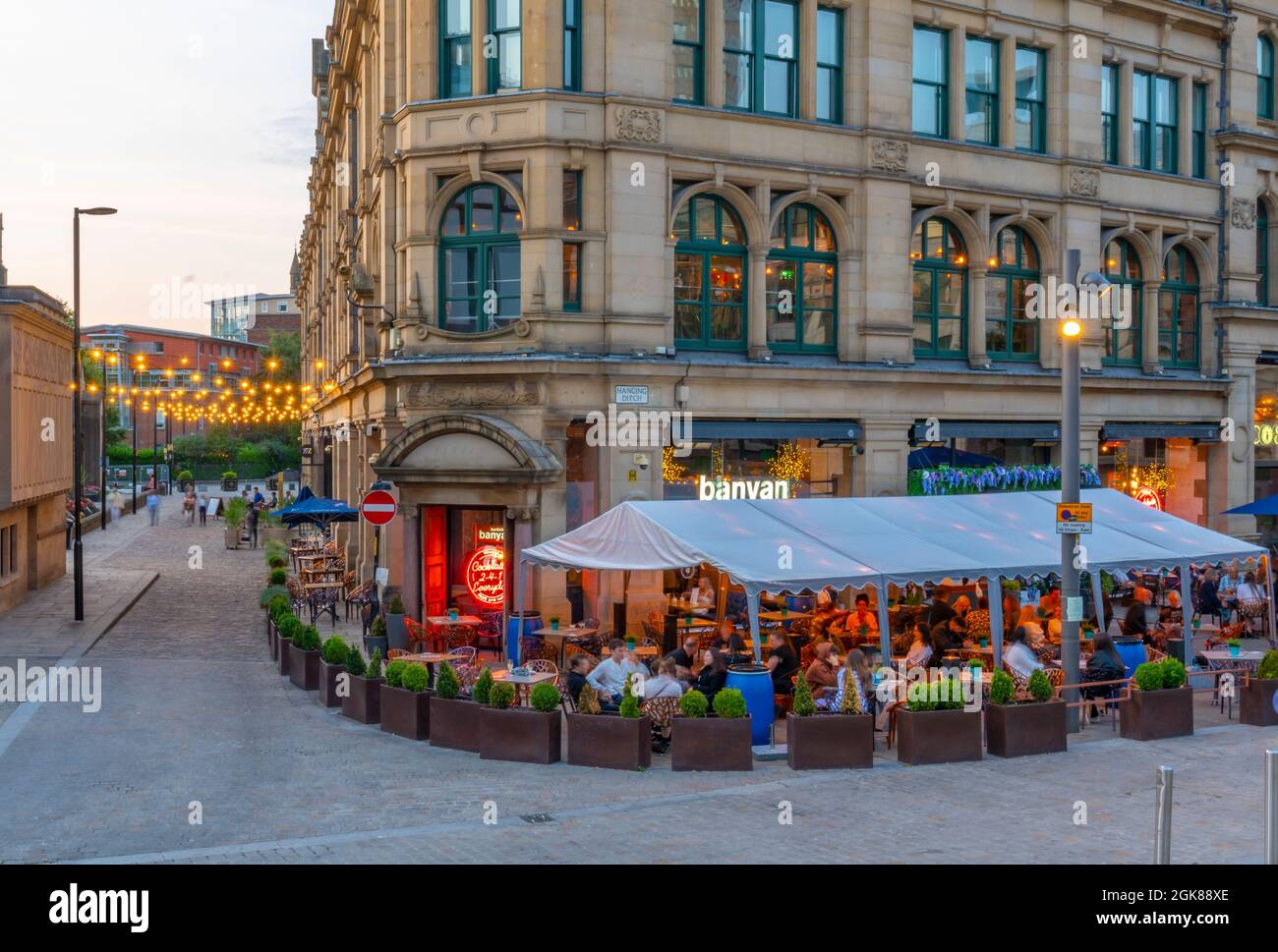 View of The Corn Echange restaurant in Exchange Square at dusk, Manchester, Lancashire, England, United Kingdom, Europe Stock Photo