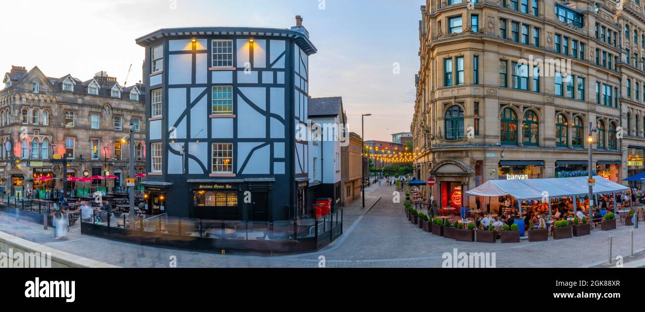 View of The Corn Echange and Oyster Bar in Exchange Square at dusk, Manchester, Lancashire, England, United Kingdom, Europe Stock Photo