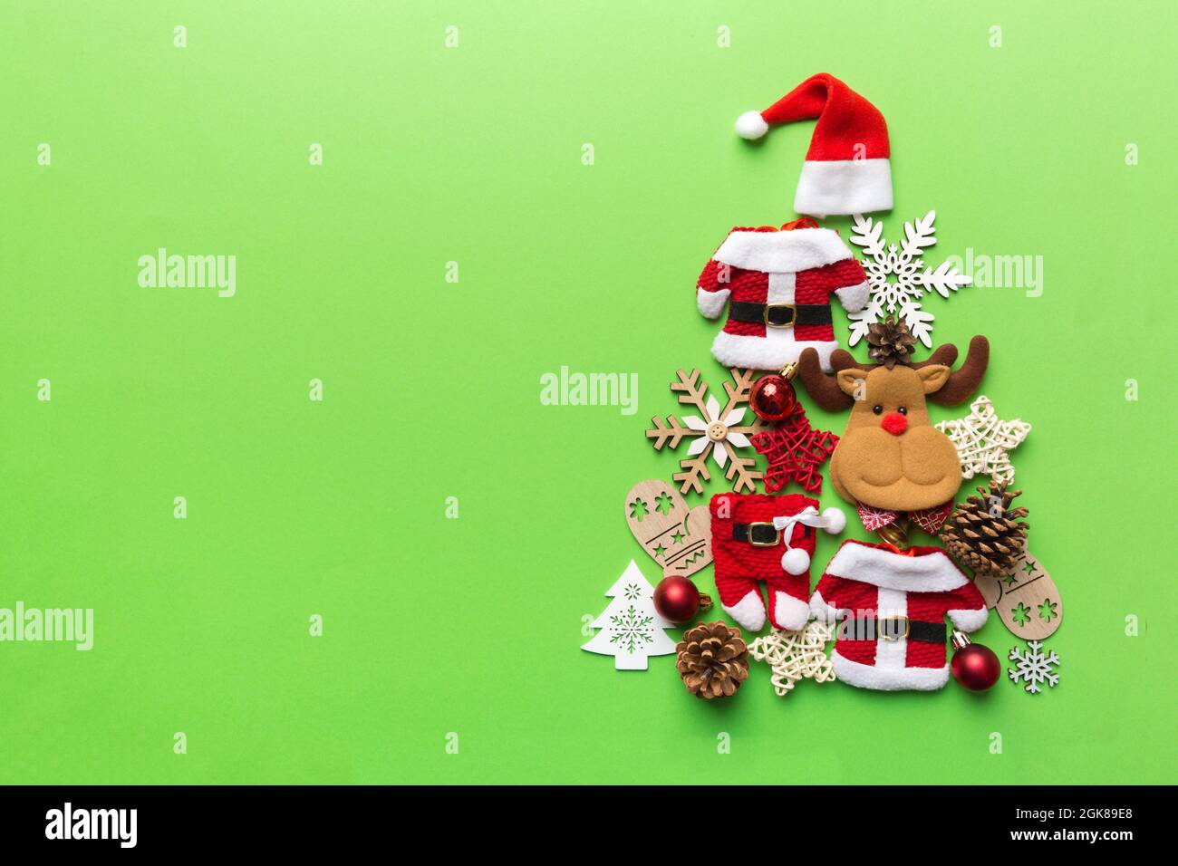 Christmas tree made from colored suit santa decoration on colored  background, view from above. New Year minimal concept with copy space Stock  Photo - Alamy