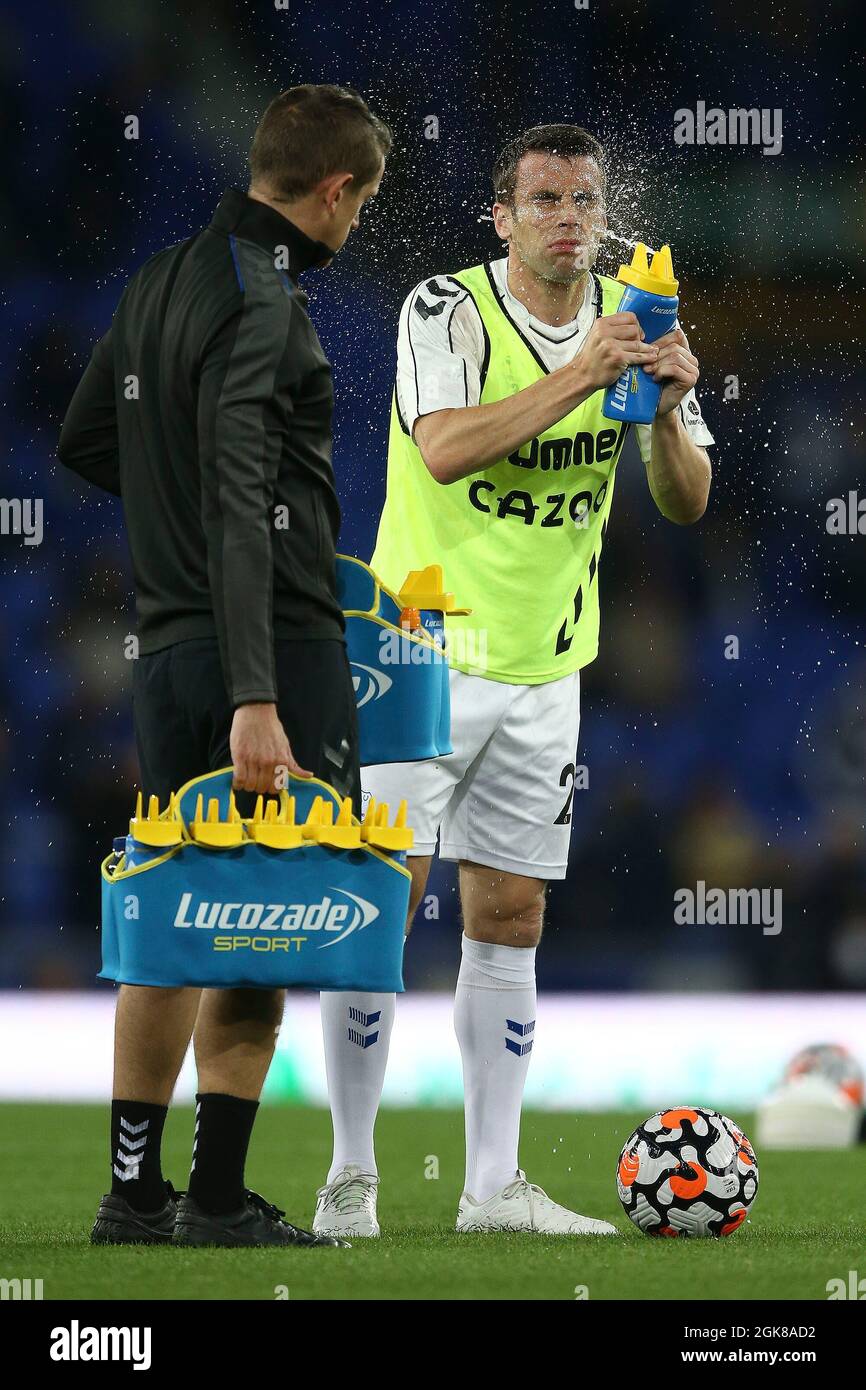 Everton, UK. 13th Sep, 2021. Seamus Coleman of Everton cools down as he squirts water in his face during the warm up. Premier League match, Everton v Burnley at Goodison Park in Liverpool on Monday 13th September 2021. this image may only be used for Editorial purposes. Editorial use only, license required for commercial use. No use in betting, games or a single club/league/player publications. pic by Chris Stading/Andrew Orchard sports photography/Alamy Live news Credit: Andrew Orchard sports photography/Alamy Live News Stock Photo