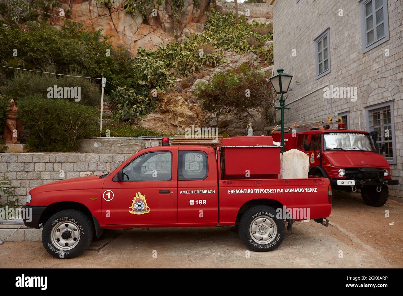 Greek fire brigade department cars outside fire station. Hydra Greece Stock Photo