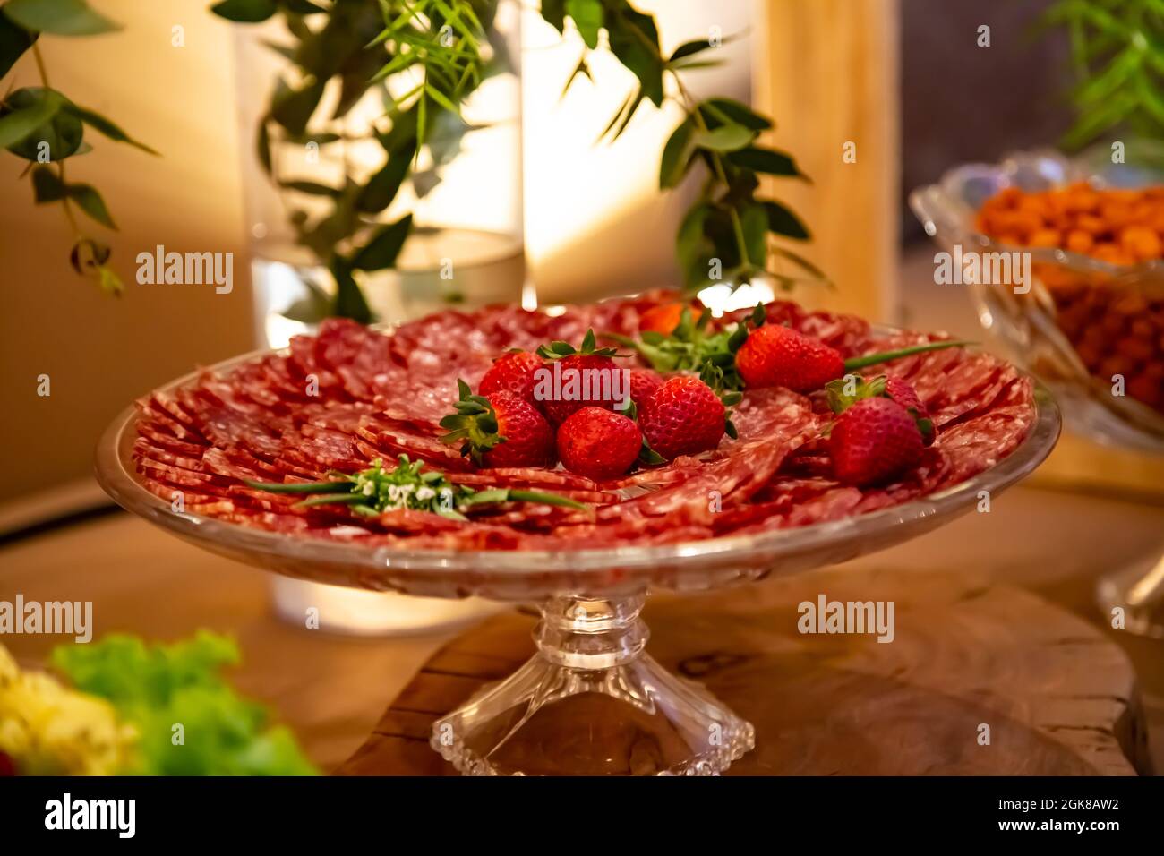 Morangos e salame fatiado. Stock Photo