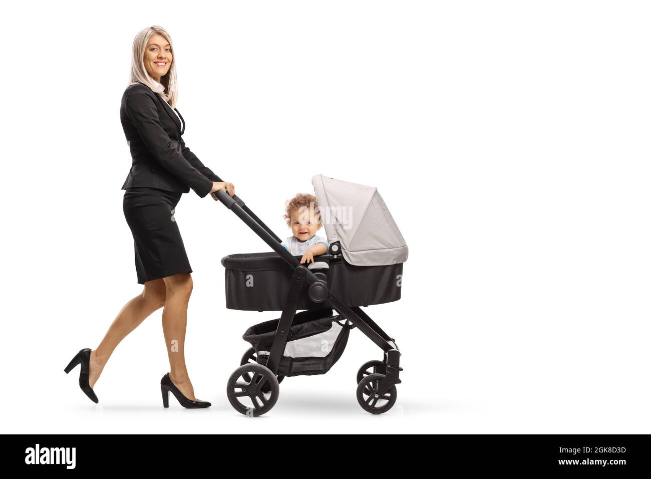 Full length shot of a businesswoman pushing a baby stroller isolated on white background Stock Photo