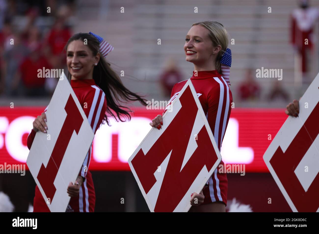 BLOOMINGTON, UNITED STATES - 2021/09/11: Indiana University cheerleaders lead a cheer before IU plays against Idaho during an NCAA football game on September 11, 2021 at Memorial Stadium in Bloomington, Ind. The Hoosiers beat the Vandals 56-14. Stock Photo