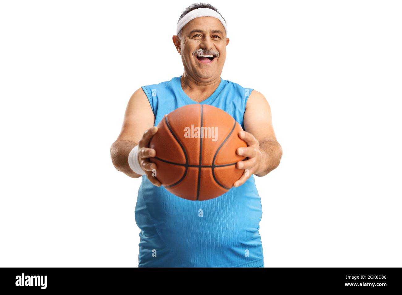 Smiling mature man shwoing a basketball in front of camera isolated on white background Stock Photo