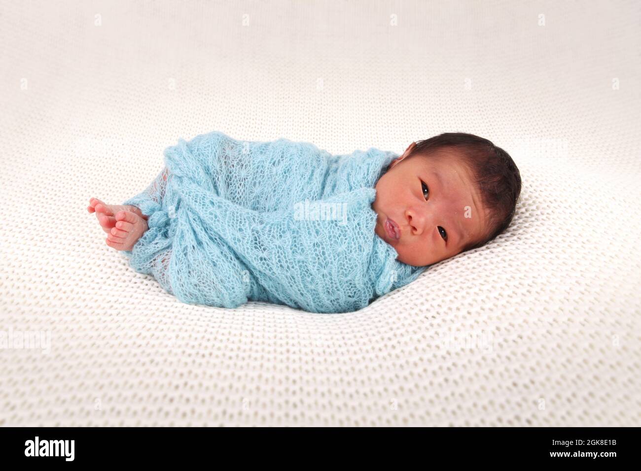 child with parents of Philippines ethnicity baby born in the UK, new born baby boy Stock Photo
