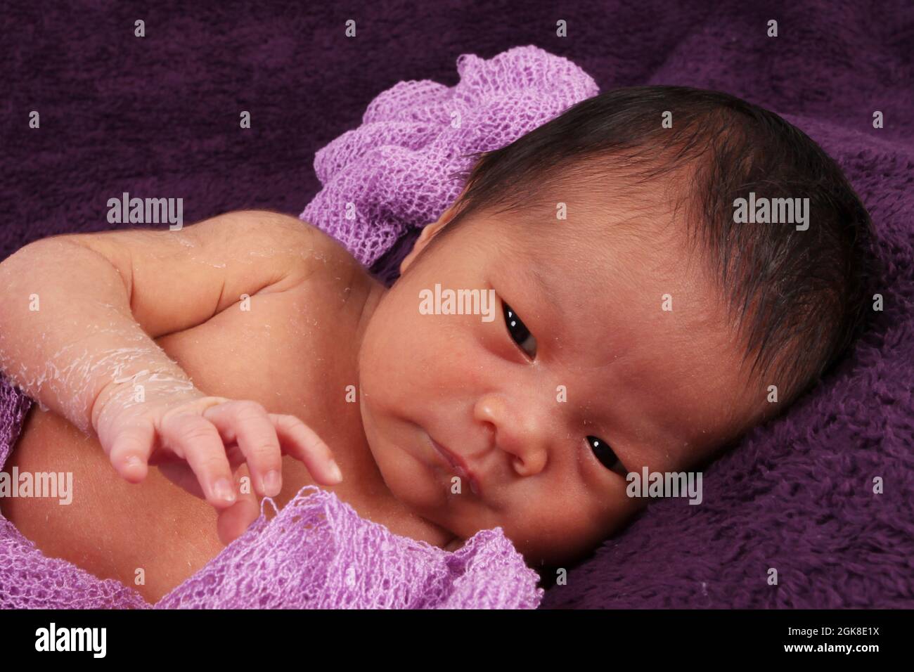 child with parents of Philippines ethnicity baby born in the UK, new born baby boy Stock Photo