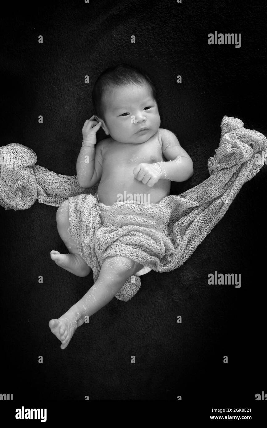 child with parents of Philippines ethnicity baby born in the UK, new born baby boy Stock Photo