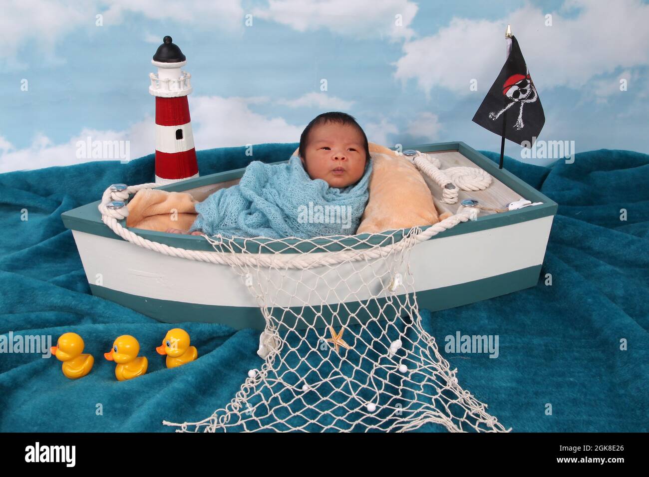 new born baby boy, Philippines ethnicity child in a boat relaxing Stock Photo
