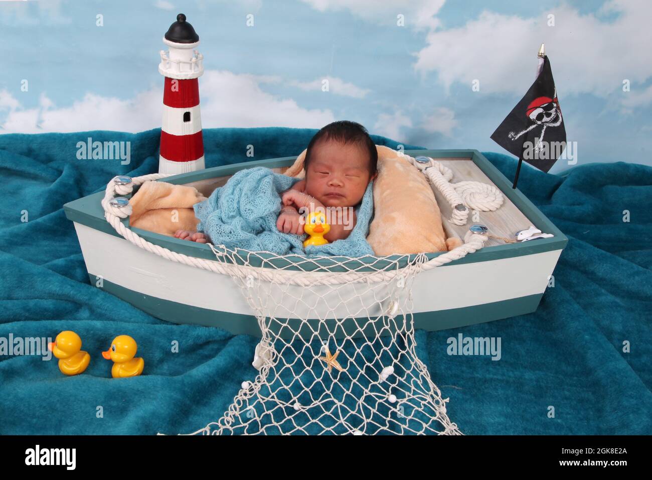 new born baby boy, Philippines ethnicity child in a boat relaxing Stock Photo