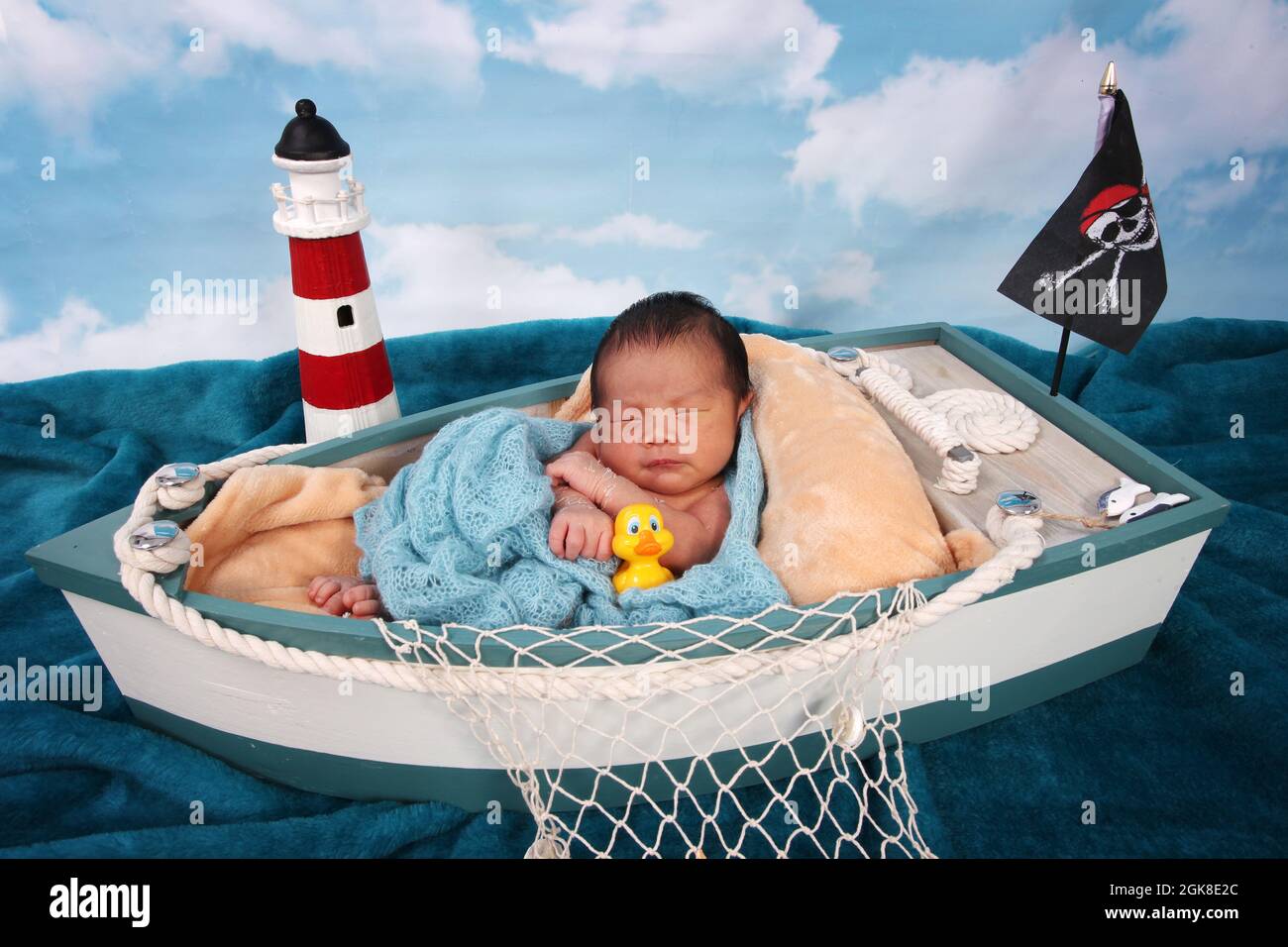 new born baby boy, Philippines ethnicity child in a boat relaxing Stock Photo