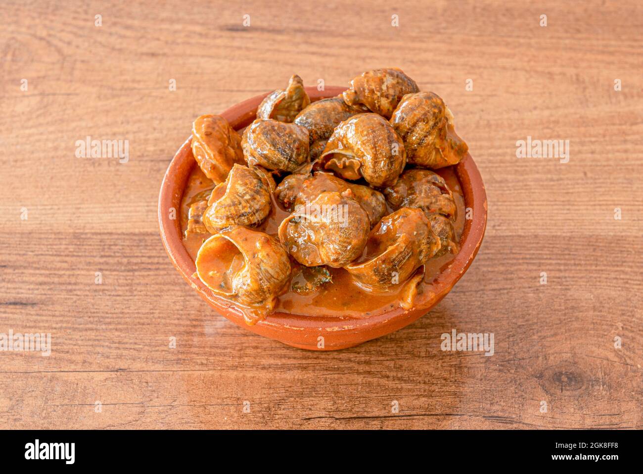 Bowl of snails. Typical Spanish snail stew with spicy sauce served in a