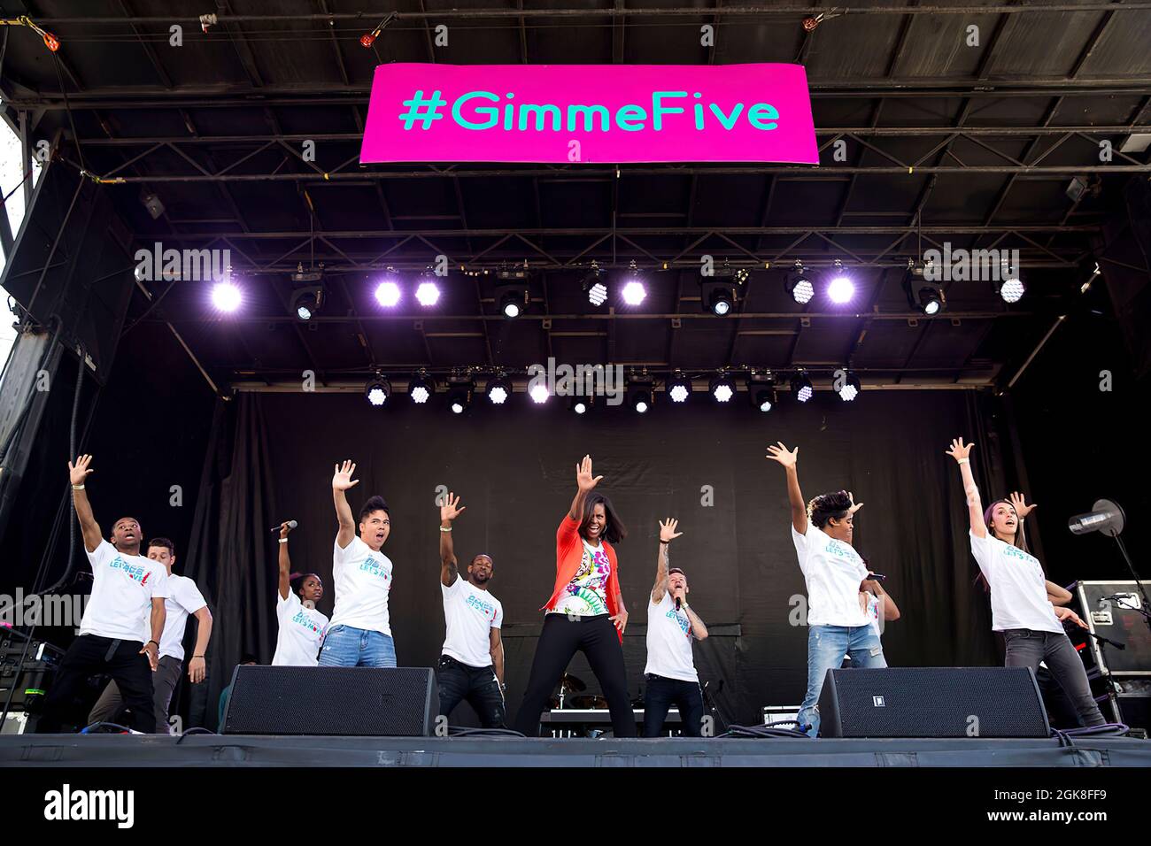First Lady Michelle Obama, in support of the 'Let's Move!' initiative, joins the 'So You Think You Can Dance' All- Stars for a performance of the #GimmeFive dance, during the annual Easter Egg Roll on the South Lawn of the White House, April 6, 2015. (Official White House Photo by Amanda Lucidon) This official White House photograph is being made available only for publication by news organizations and/or for personal use printing by the subject(s) of the photograph. The photograph may not be manipulated in any way and may not be used in commercial or political materials, advertisements, email Stock Photo
