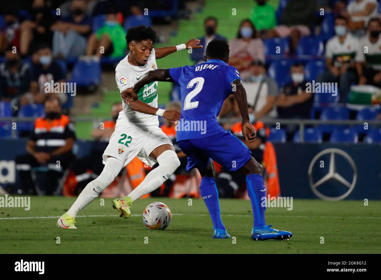 Madrid, Spain. 13th Sep 2021. Johan Mojica of Elche CF in action with Djene of Getafe CF during the Liga match between Getafe CF and Elche CF at Coliseum Alfonso Perez Stadium in Madrid, Spain. Credit: DAX Images/Alamy Live News Stock Photo