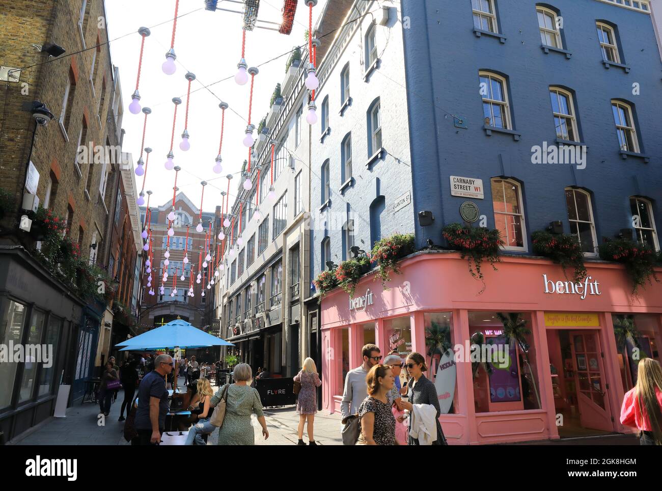 Junction of trendy shopping area Carnaby Street, and the restaurants of