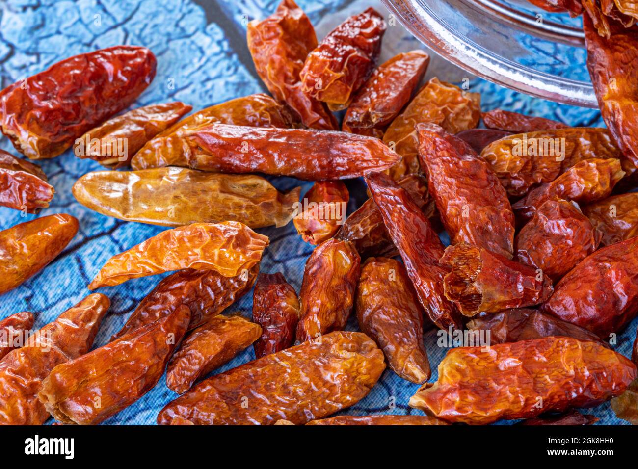 dehydrated hot chili cayenne on blue table Stock Photo - Alamy