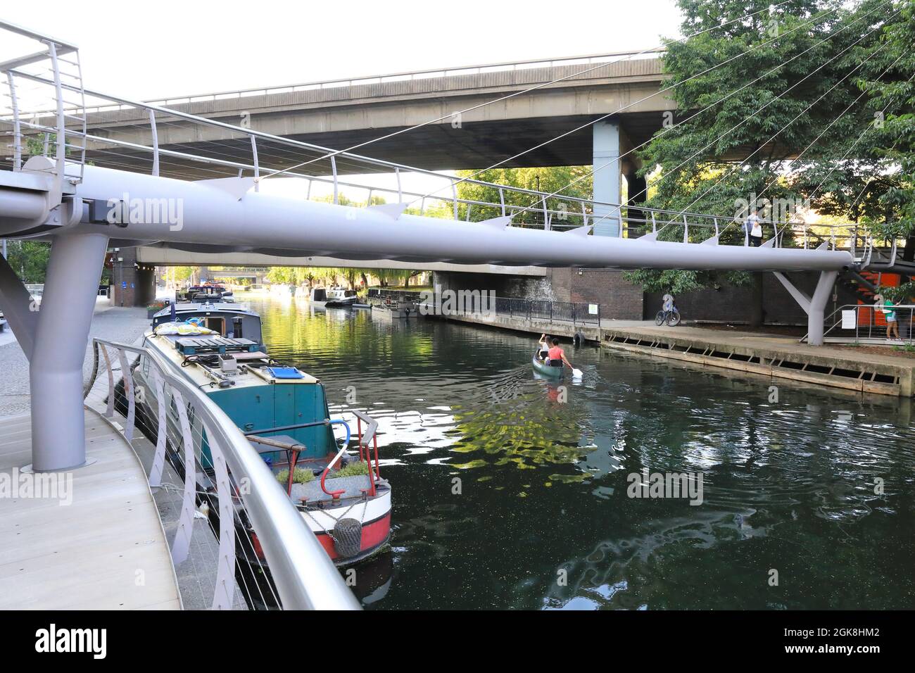Boating on the Grand Union Canal, at Paddington Central and under the A40 flyover, in west London, UK Stock Photo