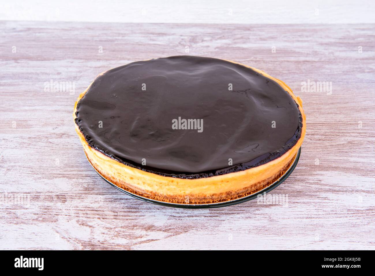 Whole lemon cheesecake with blueberry jam on top Stock Photo Alamy