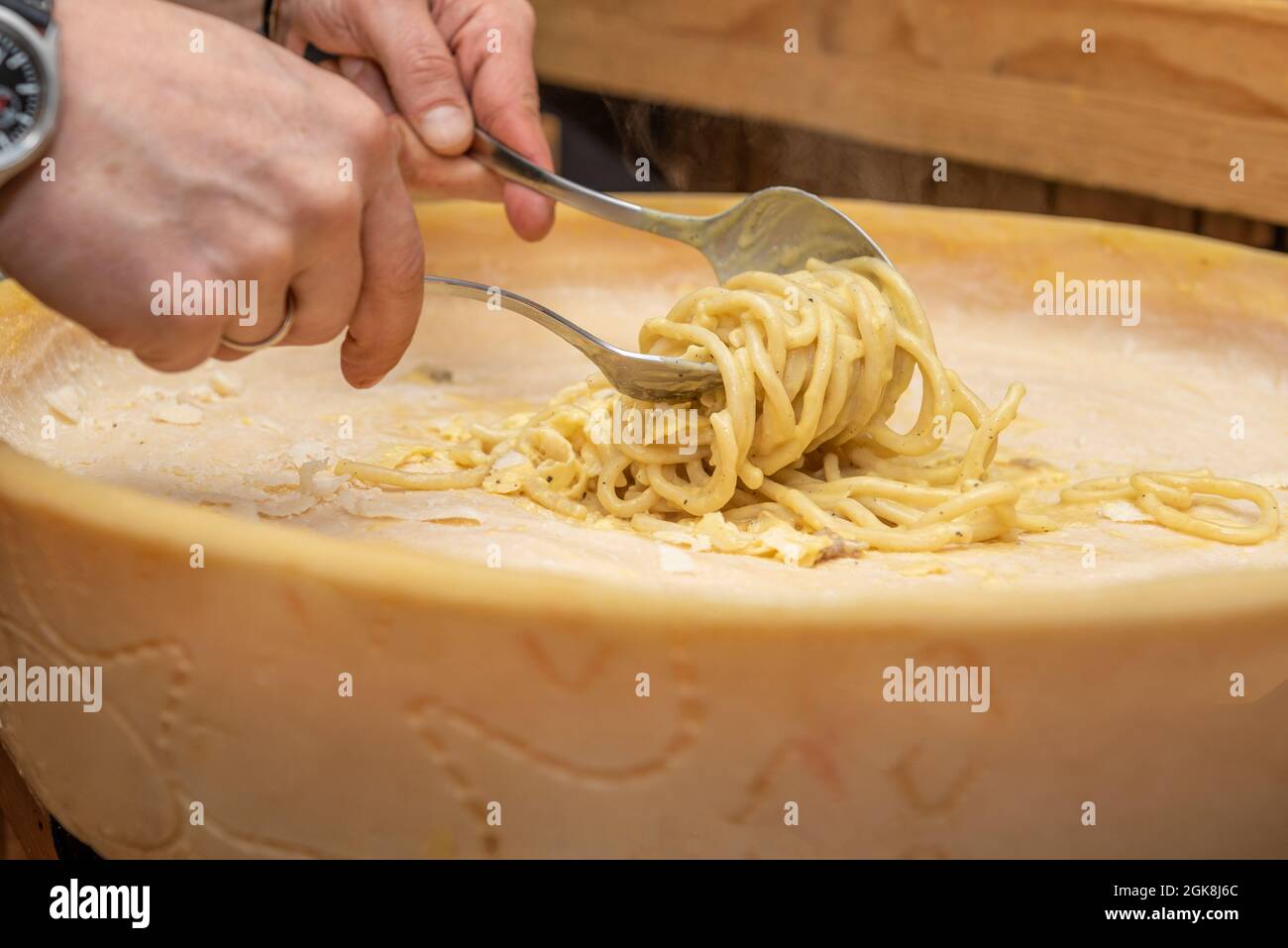 Traditional Italian spaghetti soaked inside a grana padano cheese Stock  Photo - Alamy