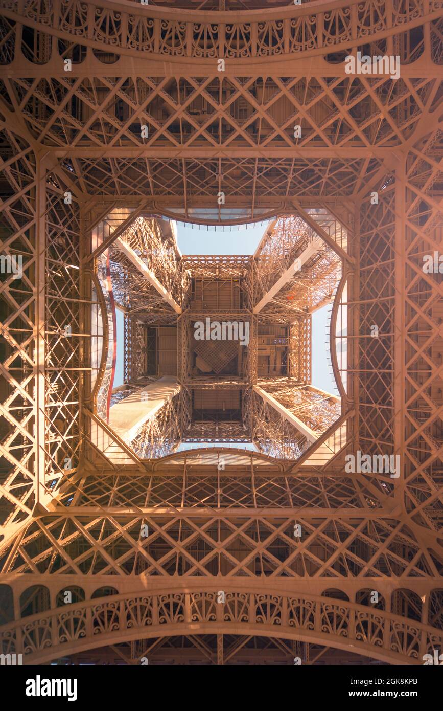 From below of observation tower with support posts and symmetrical decor on sunny day in Paris France Stock Photo