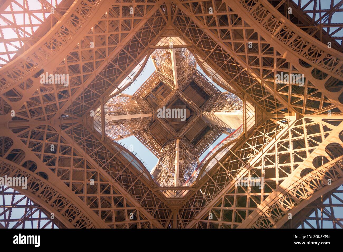 From below of observation tower with support posts and symmetrical decor on sunny day in Paris France Stock Photo