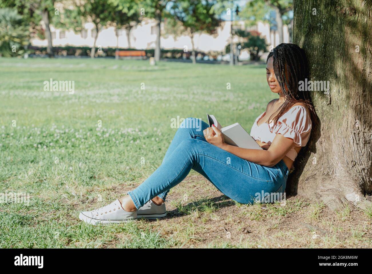 African woman sitting alone side view hi-res stock photography and ...