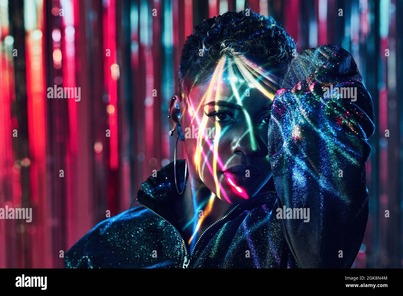 Young African American female standing looking at camera in ultraviolet